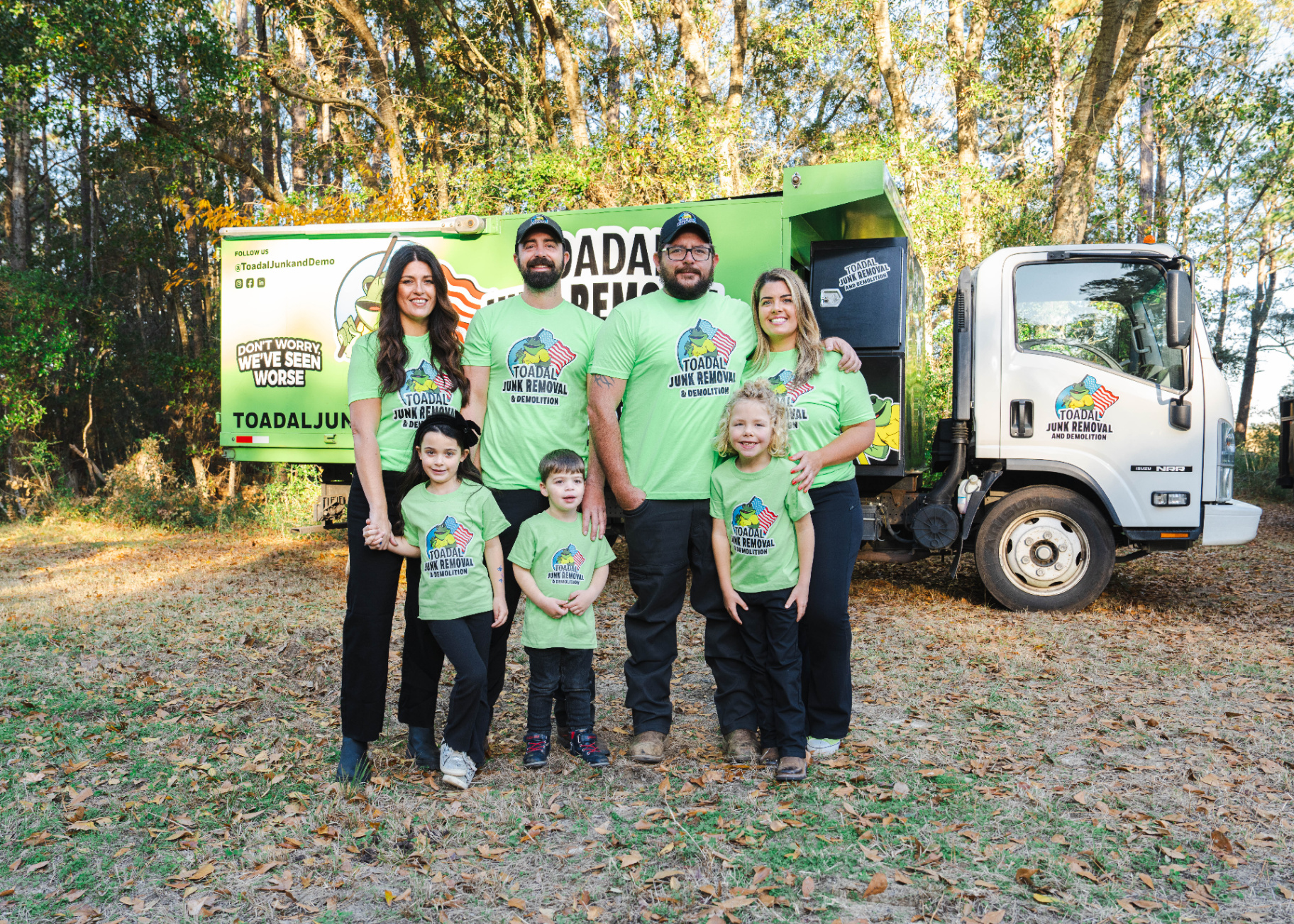 Toadal Junk Removal family team in front of their truck