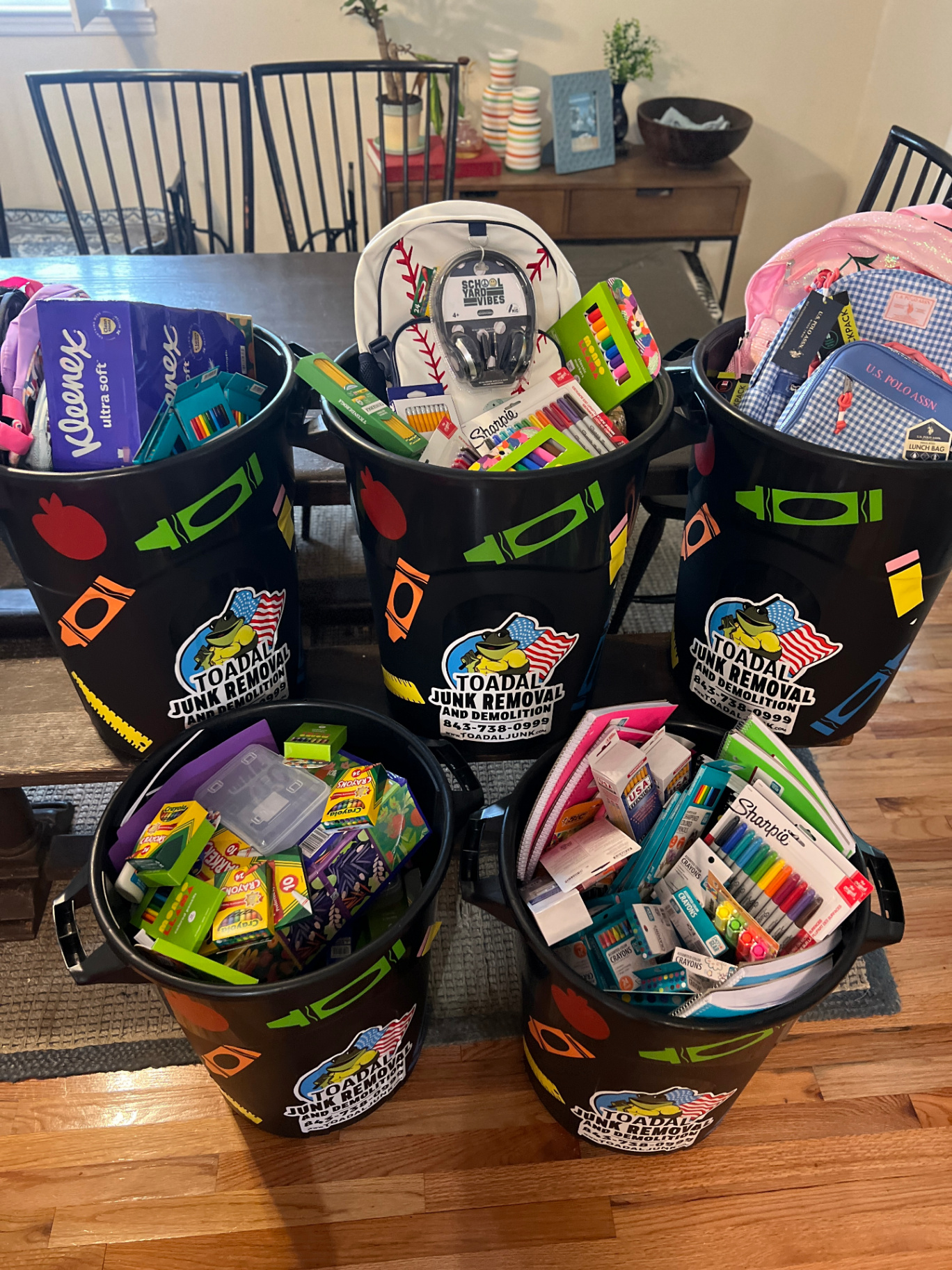 School supply drop bins filled with donated supplies